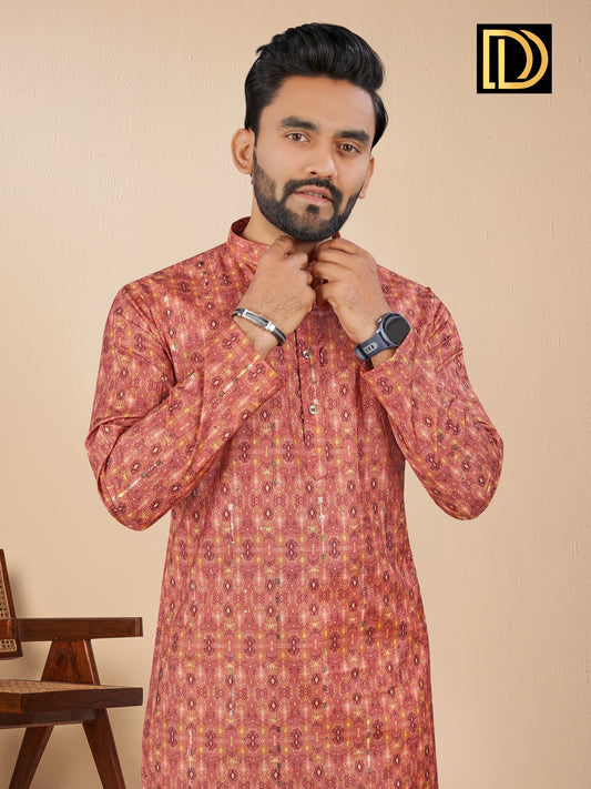 Man wearing a patterned kurta with a beige background