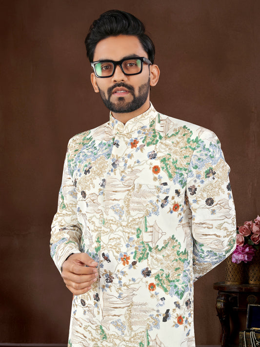 Man wearing a floral embroidered sherwani against a brown background