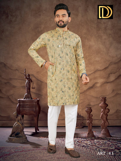 Man wearing a traditional kurta with white pants in a decorative setting with sculptures.