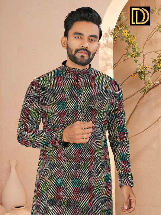 Man wearing a patterned kurta against a beige background