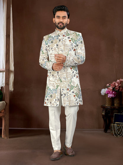 Man wearing a floral sherwani against a brown background