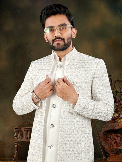 Man wearing a white sherwani with a blurred background