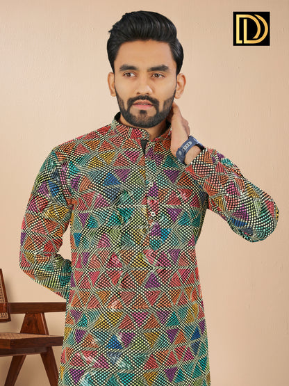 Man wearing a colorful patterned kurta against a beige background