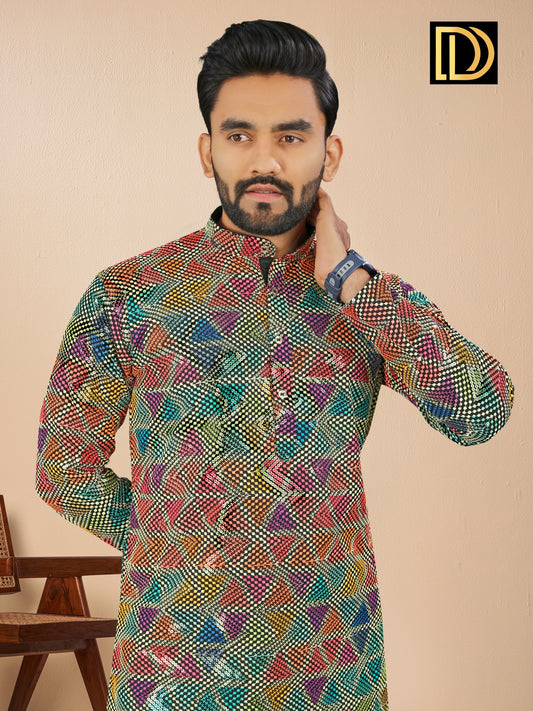 Man wearing a colorful patterned kurta against a beige background